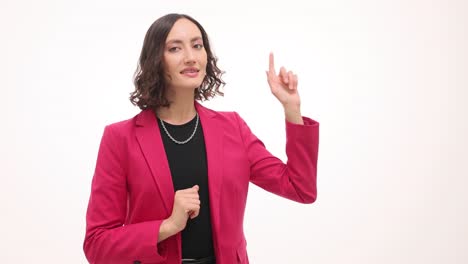 professional woman in pink blazer gesturing and pointing