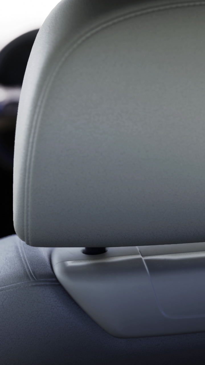 Close up view of a car headrest in a modern vehicle interior