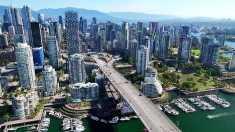 granville bridge and downtown vancouver skyscrapers on a sunny day in bc, canada