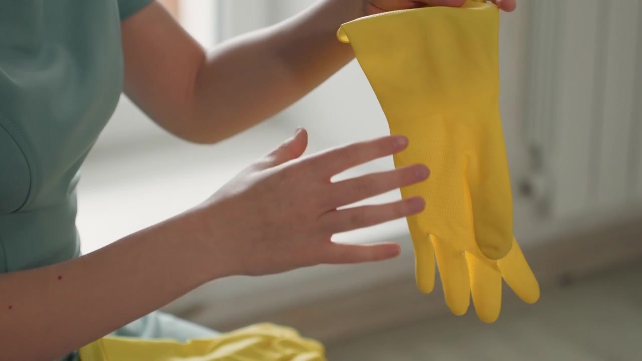 Professional gloves at work. Hands equipped with gloves meticulously performing sterilization task. Skilled personnel using gloves to conduct thorough and focused sanitization procedure