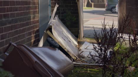 run-down alleyway in the uk with fly-tipping and litter