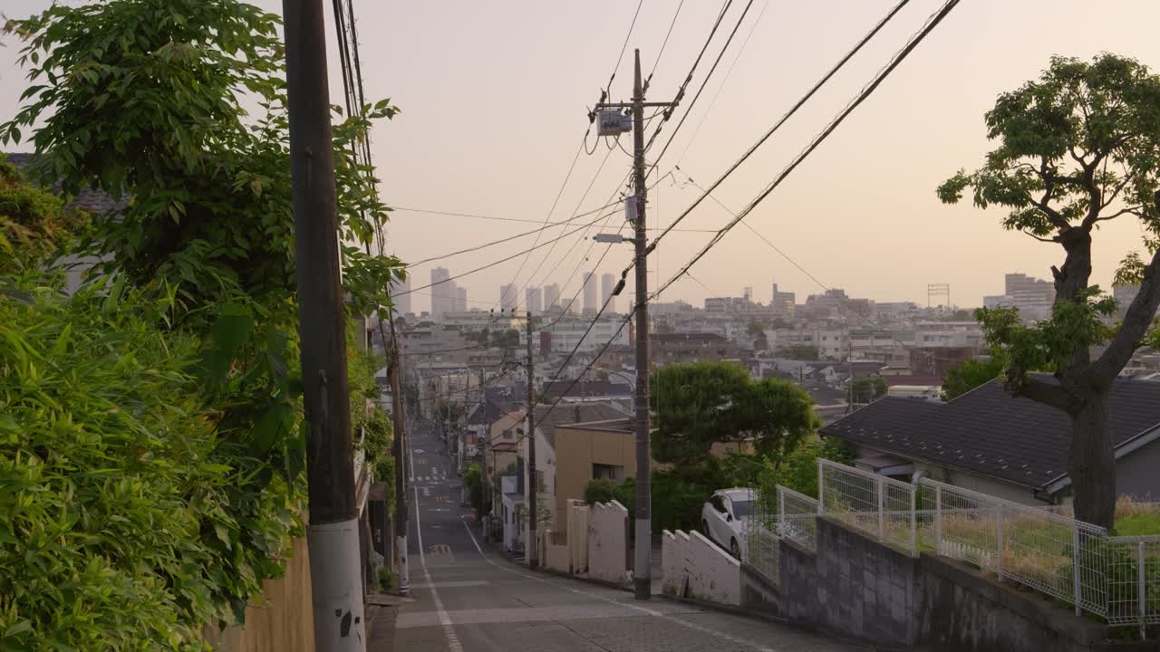 Typical daily life scenery in Tokyo with sloped road at sunset