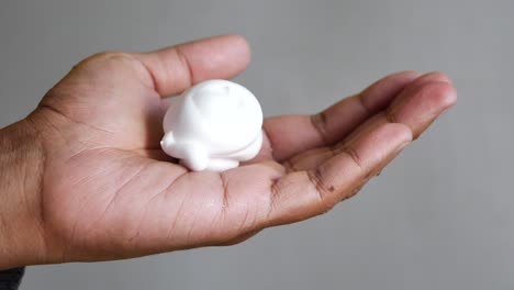 top view of shaving foam on hand