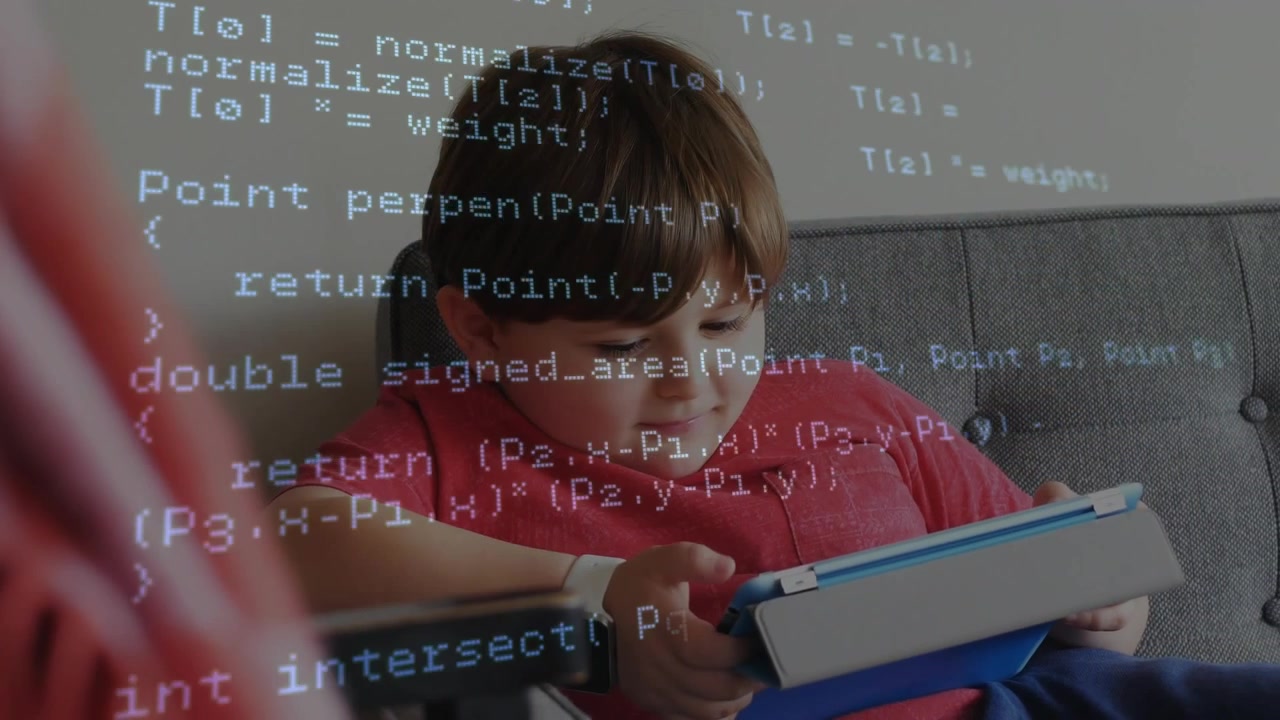 A boy is using a digital tablet in a living room at home