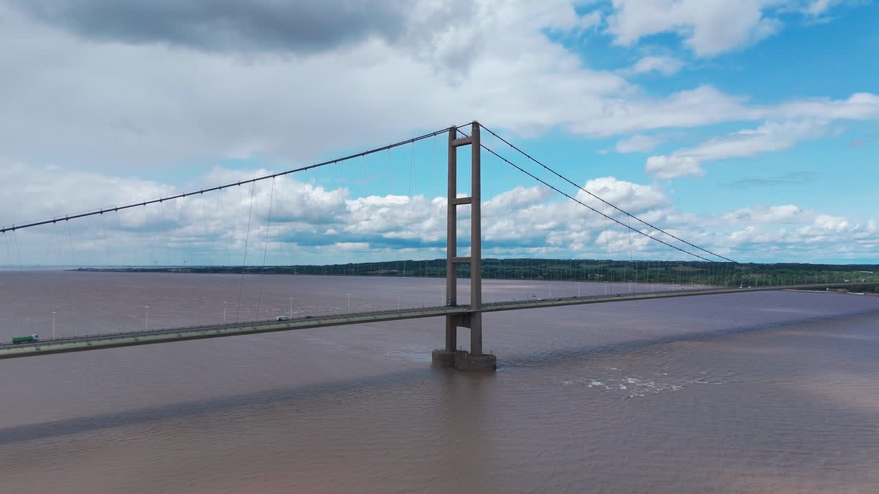 Humber Bridge over the Humber estuary with vehicles passing on a clear day