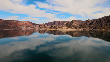 Drone-image-capturing-mountains-and-a-crystal-clear-lagoon