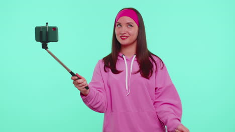 girl traveler blogger taking selfie on mobile phone, communicating video call online with family