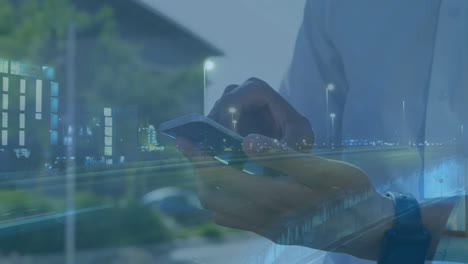 animation of man using smartphone over cityscape