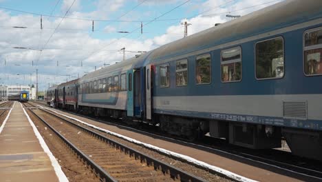 close-up of a train platform with blurred details of a train's front and visible platform markings