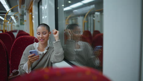 woman using a smartphone on a train