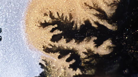 abstract textures and colors blend as substances mix in a mesmerizing macro shot close-up