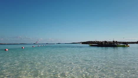 Kayak-with-seats-and-pedals-floating-in-shallow-water-of-tropical-island-paradise