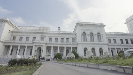 exterior of a grand palace with garden