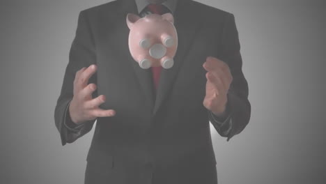 animation of businessman throwing and catching piggybank, on grey background