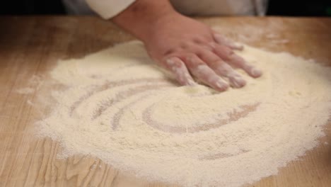 chef kneading dough for pasta