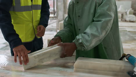 people working with marble