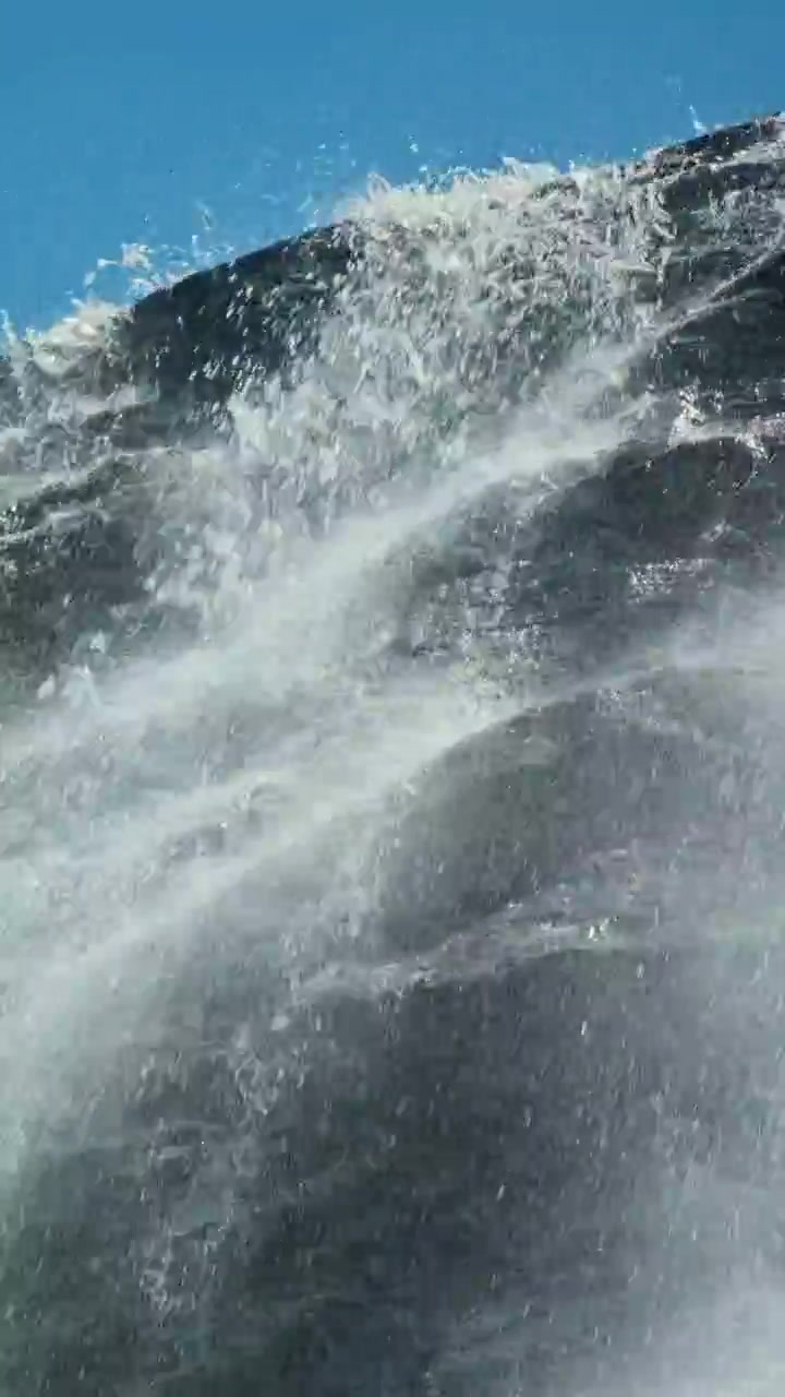 Dynamic Water Splashing Down a Rocky Waterfall
