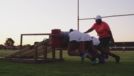 young adult female rugby players training