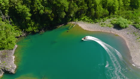 Speed-Boat-Doing-Sharp-Turn-On-Turquoise-Puelo-River-At-Lake-District,-Chile