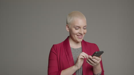 female model posing with smartphone during studio portrait 03