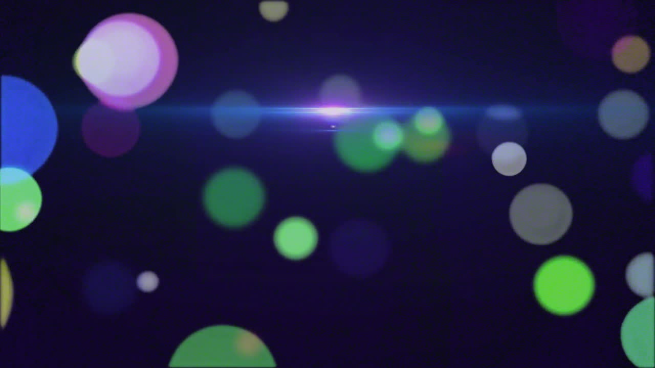 animación de puntos coloridos que se mueven sobre un fondo negro