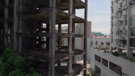 lowering boom drone shot of derelict building in macau