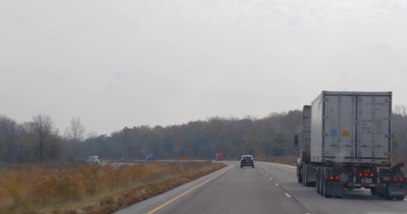 Camera car along a Canadian highway in the autumn season