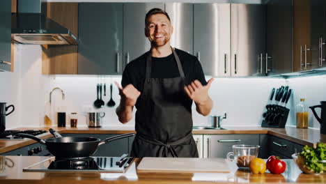 happy chef showing off in a modern kitchen