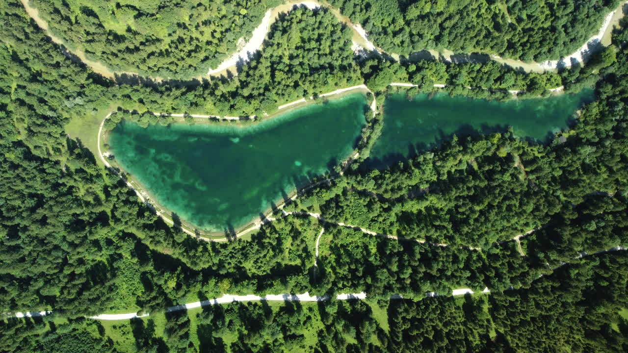 Aerial View of a Mountain Lake Surrounded by Lush Green Forest