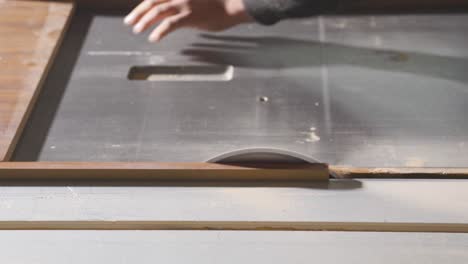 circular saw cutting wood in close-up.