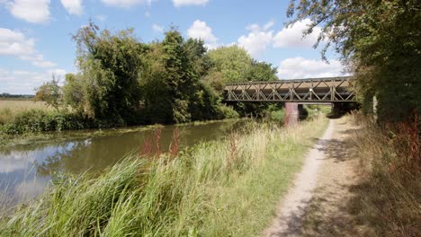 wide-shot-of-Trent-and-Mersey-Canal-with-metal-Bailey-bridge-across-the-canal-and-towpath