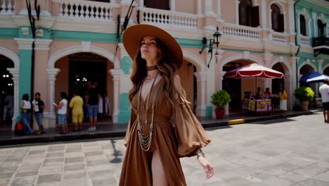 stylish woman exploring a vibrant colonial city street