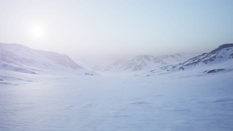 Aerial-Landscape-of-snowy-mountains-and-icy-shores-in-Antarctica