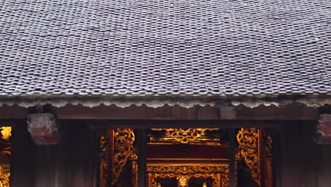 golden statue inside a traditional vietnamese temple