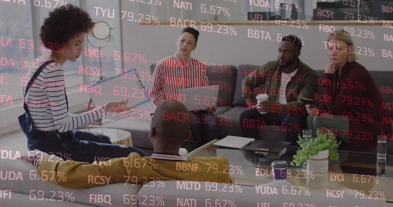 Animation of colourful autism text over business people using electronic devices