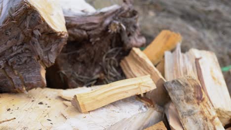 Chopping-Wood-With-Yellow-Axe,-Close-Up