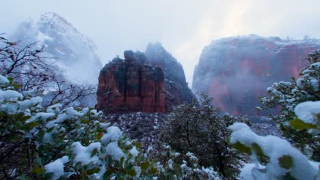 Ultra-wide-shot-of-the-mountains-in-Zion-National-park-covered-in-snow-at-the-peak