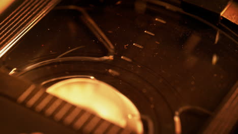 playing vhs tape - macro view of the dusty plastic casing of the cassette, 90s vibe