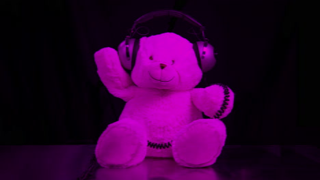 pink teddy bear with headphones