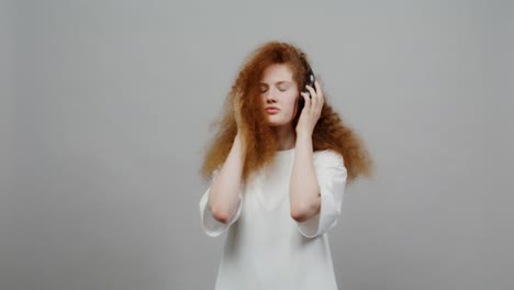 young woman listening to music with headphones