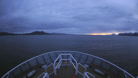 point of view time lapse of a ship cruising up chatham strait at dusk in southeast alaska