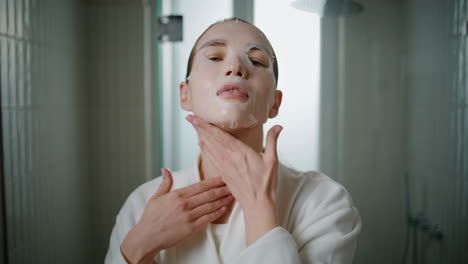 Closeup lady put mask with serum in morning. woman relaxing at home