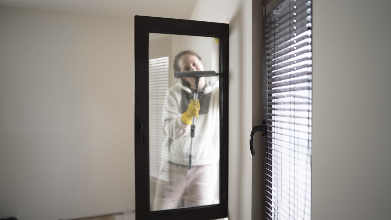 Lifestyle concept of spring cleaning at home with focus on window washing, hygiene, and comfort