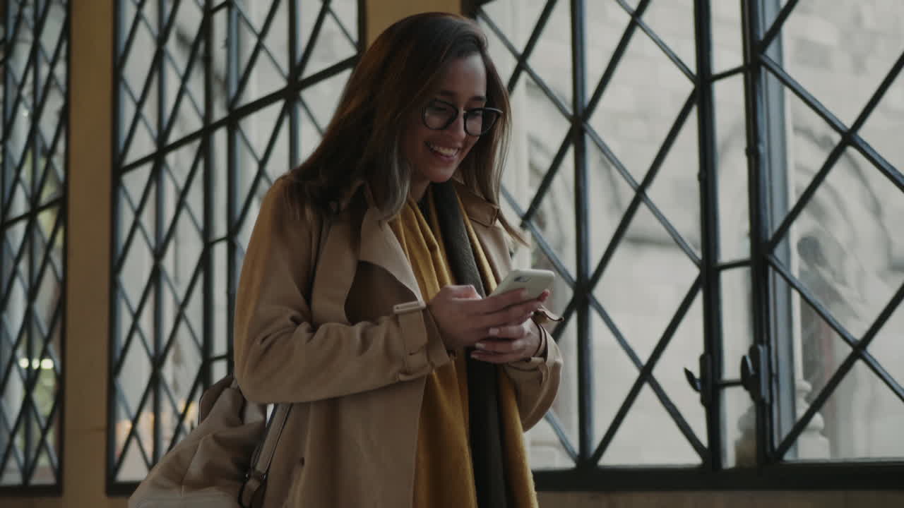 Student waving hand to classmate in university