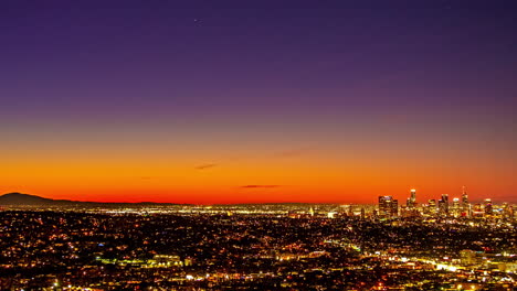 los angeles skyline from night to sunrise from kenneth hahn view point in california, usa