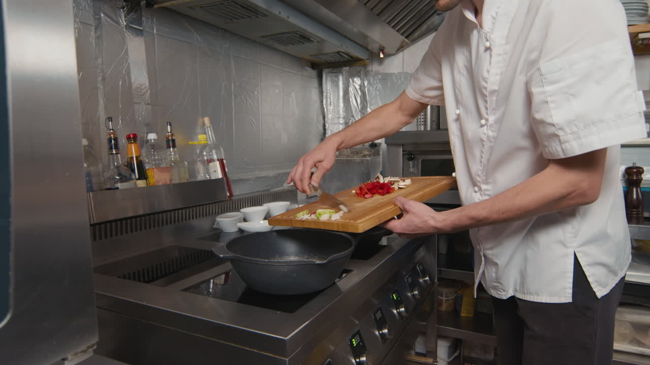 Adding Vegetables To Wok Pan