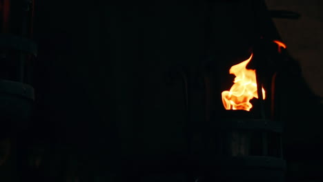 flames of a torches in the dark on a black background