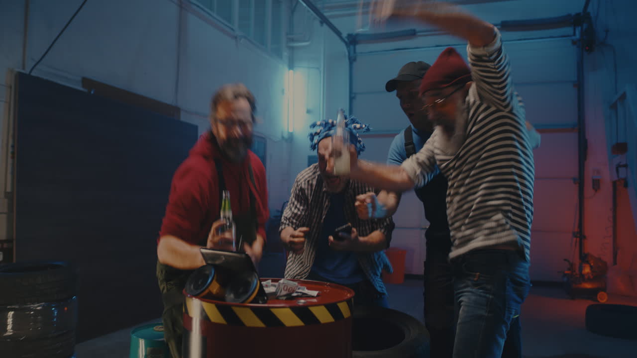 Friends Celebrating a Win in a Garage