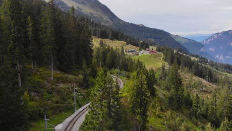 Aerial:-little-mountain-train-in-the-Jungfraujoch-region-3