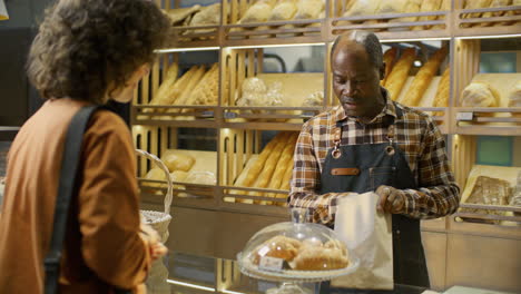 customer purchasing bread at a bakery